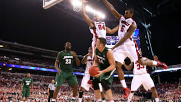 INDIANAPOLIS - MARCH 29: Goran Suton #14 of the Michigan State Spartans looks to go up for a shot against Samardo Samuels #24 and Earl Clark #5 of the Louisville Cardinals during the fourth round of the NCAA Division I Men's Basketball Tournament at the Lucas Oil Stadium on March 29, 2009 in Indianapolis, Indiana. (Photo by Andy Lyons/Getty Images)