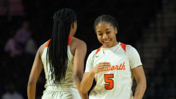 Ensworth's Kennedy Cambridge (3) celebrates with Ensworth's Jayda Woods (5) after taking the lead against Knoxville Catholic at Hooper Eblen Center in Cookeville, Tenn., Thursday, March 3, 2022.Sa45488