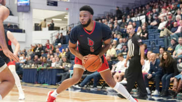 WASHINGTON, DC- JANUARY 11: Marcus Weathers #5 of the Duquesne Dukes looks to pass the ball during a college basketball game against the George Washington Colonials at the Smith Arena on January 11, 2020 in Washington, DC. (Photo by Mitchell Layton/Getty Images)