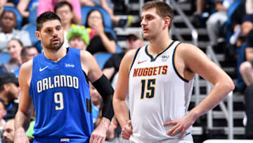 Nikola Vucevic #9 of the Orlando Magic standing with Nikola Jokic #15 of the Denver Nuggets (Photo by Fernando Medina/NBAE via Getty Images)