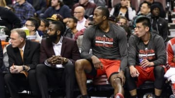 Nov 13, 2013; Philadelphia, PA, USA; Houston Rockets guard James Harden (13) forward Dwight Howard (12) and guard Jeremy Lin (7) (L to R) watch from the bench during the third quarter against the Philadelphia 76ers at Wells Fargo Center. The Sixers defeated the Rockets 123-117. Mandatory Credit: Howard Smith-USA TODAY Sports