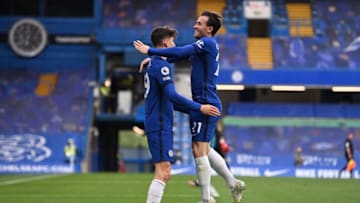 Chelsea's English defender Ben Chilwell leaps into the arms of Chelsea's German midfielder Kai Havertz as they celebrate after Havertz scores their second goal during the English Premier League football match between Chelsea and Fulham at Stamford Bridge in London on May 1, 2021. - RESTRICTED TO EDITORIAL USE. No use with unauthorized audio, video, data, fixture lists, club/league logos or 'live' services. Online in-match use limited to 120 images. An additional 40 images may be used in extra time. No video emulation. Social media in-match use limited to 120 images. An additional 40 images may be used in extra time. No use in betting publications, games or single club/league/player publications. (Photo by Justin Setterfield / POOL / AFP) / RESTRICTED TO EDITORIAL USE. No use with unauthorized audio, video, data, fixture lists, club/league logos or 'live' services. Online in-match use limited to 120 images. An additional 40 images may be used in extra time. No video emulation. Social media in-match use limited to 120 images. An additional 40 images may be used in extra time. No use in betting publications, games or single club/league/player publications. / RESTRICTED TO EDITORIAL USE. No use with unauthorized audio, video, data, fixture lists, club/league logos or 'live' services. Online in-match use limited to 120 images. An additional 40 images may be used in extra time. No video emulation. Social media in-match use limited to 120 images. An additional 40 images may be used in extra time. No use in betting publications, games or single club/league/player publications. (Photo by JUSTIN SETTERFIELD/POOL/AFP via Getty Images)
