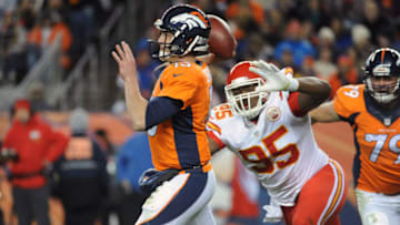 DENVER, CO. - NOVEMBER 27: Denver Broncos quarterback Trevor Siemian gets a pass off under pressure by Kansas City Chiefs defender Chris Jones in the second quarter at Sports Authority Field Sunday, November 27, 2016. (Photo by Steve Nehf / The Denver Post)