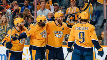 NASHVILLE, TN - OCTOBER 15: Mattias Ekholm #14 celebrates his goal with P.K. Subban #76, Filip Forsberg #9 and Ryan Ellis #4 of the Nashville Predators against the Minnesota Wild during an NHL game at Bridgestone Arena on October 15, 2018 in Nashville, Tennessee. (Photo by John Russell/NHLI via Getty Images)