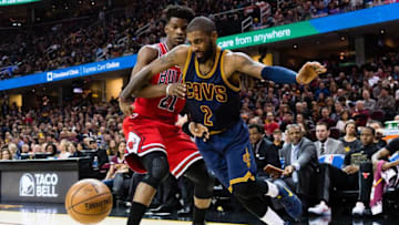 CLEVELAND, OH - FEBRUARY 25: Kyrie Irving #2 of the Cleveland Cavaliers tries to drive past Jimmy Butler #21 of the Chicago Bulls during the first half at Quicken Loans Arena on February 25, 2017 in Cleveland, Ohio. NOTE TO USER: User expressly acknowledges and agrees that, by downloading and/or using this photograph, user is consenting to the terms and conditions of the Getty Images License Agreement. (Photo by Jason Miller/Getty Images)