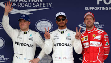 SUZUKA, JAPAN - OCTOBER 07: Top three qualifiers Lewis Hamilton of Great Britain and Mercedes GP, Valtteri Bottas of Finland and Mercedes GP and Sebastian Vettel of Germany and Ferrari in parc ferme during qualifying for the Formula One Grand Prix of Japan at Suzuka Circuit on October 7, 2017 in Suzuka. (Photo by Mark Thompson/Getty Images)