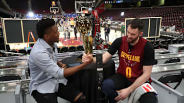 CLEVELAND, OH - JUNE 5: Donovan Mitchell of the Utah Jazz interviews Kevin Love #0 of the Cleveland Cavaliers during practice and media availability as part of the 2018 NBA Finals on June 5, 2018 at Quicken Loans Arena in Cleveland, Ohio. NOTE TO USER: User expressly acknowledges and agrees that, by downloading and or using this photograph, User is consenting to the terms and conditions of the Getty Images License Agreement. Mandatory Copyright Notice: Copyright 2018 NBAE (Photo by Joe Murphy/NBAE via Getty Images)