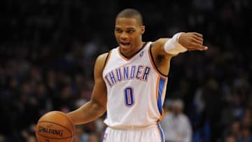 Dec 22, 2013; Oklahoma City, OK, USA; Oklahoma City Thunder point guard Russell Westbrook (0) directs his team in action against the Toronto Raptors during the third quarter at Chesapeake Energy Arena. Mandatory Credit: Mark D. Smith-USA TODAY Sports
