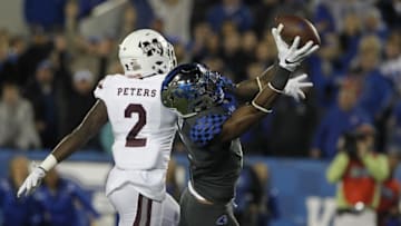Oct 22, 2016; Lexington, KY, USA; Kentucky Wildcats wide receiver Dorian Baker (2) reaches for a pass against Mississippi State Bulldogs defensive back Jamal Peters (2) in the second half at Commonwealth Stadium. Kentucky defeated Mississippi 40-38. Mandatory Credit: Mark Zerof-USA TODAY Sports