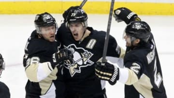 May 13, 2014; Pittsburgh, PA, USA; Pittsburgh Penguins left wing Jussi Jokinen (36) and center Evgeni Malkin (71) and defenseman Matt Niskanen (2) celebrate a goal by Jokinen against the New York Rangers during the second period in game seven of the second round of the 2014 Stanley Cup Playoffs at the CONSOL Energy Center. Mandatory Credit: Charles LeClaire-USA TODAY Sports