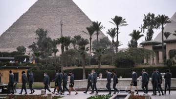 France's national team players walk in their hotel in front of Giza Pyramids, on January 13, 2021 in the Egyptian capital Cairo on the eve of the 2021 World Men's Handball Championship match between Group E teams Norway and France. (Photo by Anne-Christine POUJOULAT / AFP) (Photo by ANNE-CHRISTINE POUJOULAT/AFP via Getty Images)
