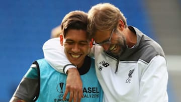 BASEL, SWITZERLAND - MAY 17: Roberto Firmino of Liverpool laughs with manager Jurgen Klopp during a Liverpool training session on the eve of the UEFA Europa League Final against Sevilla at St. Jakob-Park on May 17, 2016 in Basel, Switzerland. (Photo by Michael Steele/Getty Images)