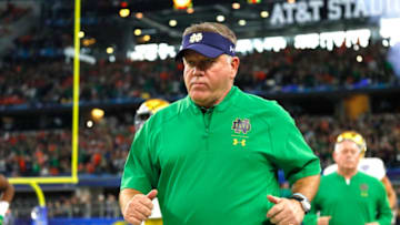 ARLINGTON, TEXAS - DECEMBER 29: Head coach Brian Kelly of the Notre Dame Fighting Irish takes the field with his team before the game against the Clemson Tigers during the College Football Playoff Semifinal Goodyear Cotton Bowl Classic at AT&T Stadium on December 29, 2018 in Arlington, Texas. (Photo by Kevin C. Cox/Getty Images)