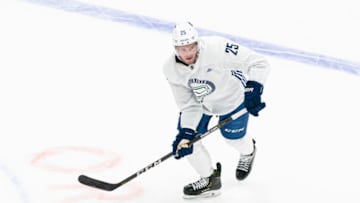 VANCOUVER, BC - JANUARY 4: Brogan Rafferty #25 of the Vancouver Canucks skates with the puck on the first day of the Vancouver Canucks NHL Training Camp on January, 4, 2021 at Rogers Arena in Vancouver, British Columbia, Canada. (Photo by Rich Lam/Getty Images)