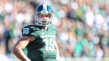 Oct 25, 2014; East Lansing, MI, USA; Michigan State Spartans quarterback Connor Cook (18) stands on the field between plays during the 1st quarter of a game at Spartan Stadium. Mandatory Credit: Mike Carter-USA TODAY Sports