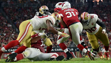 Nov 13, 2016; Glendale, AZ, USA; San Francisco 49ers defensive end Glenn Dorsey (90) tackles Arizona Cardinals running back David Johnson (31) during the second half at University of Phoenix Stadium. The Cardinals won 23-20. Mandatory Credit: Joe Camporeale-USA TODAY Sports