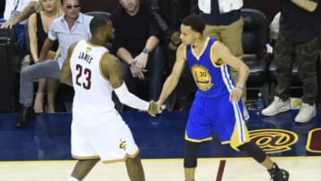 Jun 16, 2015; Cleveland, OH, USA; Cleveland Cavaliers forward LeBron James (23) shakes hands with Golden State Warriors guard Stephen Curry (30) during the fourth quarter of game six of the NBA Finals at Quicken Loans Arena. Warriors won 105-97. Mandatory Credit: Ken Blaze-USA TODAY Sports