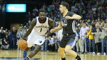Apr 9, 2016; Memphis, TN, USA; Memphis Grizzlies guard Lance Stephenson (1) dribbles the ball as Golden State Warriors guard Klay Thompson (11) defends during the final seconds on the game at FedExForum. The Warriors won 100-99. Mandatory Credit: Nelson Chenault-USA TODAY Sports