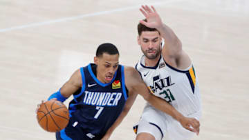 OKC Thunder forward Darius Bazley (7) drives to the basket around Utah Jazz forward Georges Niang (31). Mandatory Credit: Alonzo Adams-USA TODAY Sports.