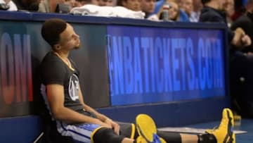 Feb 27, 2016; Oklahoma City, OK, USA; Golden State Warriors guard Stephen Curry (30) prepares to return the game after having his ankle examined during action against the Oklahoma City Thunder at Chesapeake Energy Arena. Mandatory Credit: Mark D. Smith-USA TODAY Sports