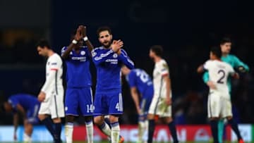 LONDON, ENGLAND - MARCH 09: A dejected Cesc Fabregas of Chelsea applauds the home fans foloowing thjeir team's 2-1 defeat and exit from the competition during the UEFA Champions League round of 16, second leg match between Chelsea and Paris Saint Germain at Stamford Bridge on March 9, 2016 in London, United Kingdom. (Photo by Clive Rose/Getty Images)