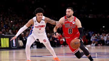 Zach LaVine of the Chicago Bulls dribbles the ball past Killian Hayes of the Detroit Pistons (Photo by Dean Mouhtaropoulos/Getty Images)