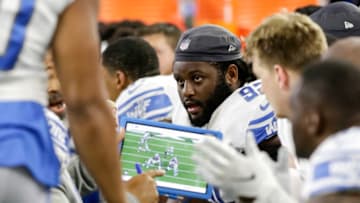 HOUSTON, TX - AUGUST 17: P.J. Johnson #92 of the Detroit Lions reviews a play on the bench in the first half against the Houston Texans during the preseason game at NRG Stadium on August 17, 2019 in Houston, Texas. (Photo by Tim Warner/Getty Images)