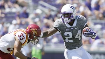 Sep 17, 2016; Fort Worth, TX, USA; TCU Horned Frogs running back Trevorris Johnson (24) stiff arms Iowa State Cyclones defensive back Braxton Lewis (33) in the third quarter at Amon G. Carter Stadium. TCU won 41-20. Mandatory Credit: Tim Heitman-USA TODAY Sports