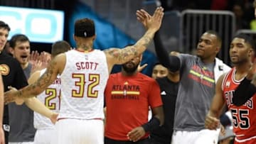 Jan 9, 2016; Atlanta, GA, USA; Atlanta Hawks forward Mike Scott (32) celebrates with forward Paul Millsap (4) (grey shirt) near the end of the game against the Chicago Bulls at Philips Arena. The Hawks defeated the Bulls 120-105. Mandatory Credit: Dale Zanine-USA TODAY Sports