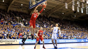DURHAM, NORTH CAROLINA - JANUARY 18: Jordan Goldwire #14 of the Duke Blue Devils watches as Samuell Williamson #10 of the Louisville Cardinals dunks the ball during their game at Cameron Indoor Stadium on January 18, 2020 in Durham, North Carolina. (Photo by Streeter Lecka/Getty Images)