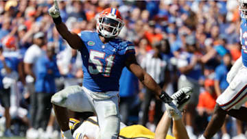 Oct 8, 2022; Gainesville, Florida, USA; Florida Gators linebacker Ventrell Miller (51) sacks Missouri Tigers quarterback Brady Cook (12) during the second half at Ben Hill Griffin Stadium. Mandatory Credit: Kim Klement-USA TODAY Sports