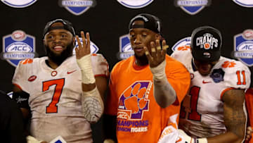 CHARLOTTE, NC - DECEMBER 01: Austin Bryant #7 and teammates Clelin Ferrell #99 and Isaiah Simmons #11 of the Clemson Tigers signal four ACC Championships in a row after their 42-10 victory over the Pittsburgh Panthers at Bank of America Stadium on December 1, 2018 in Charlotte, North Carolina. (Photo by Streeter Lecka/Getty Images)