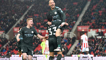 STOKE ON TRENT, ENGLAND - MARCH 12: David Silva of Manchester City (21) celebrates as he scores their second goal with Kevin De Bruyne and Gabriel Jesus during the Premier League match between Stoke City and Manchester City at Bet365 Stadium on March 12, 2018 in Stoke on Trent, England. (Photo by Michael Regan/Getty Images)