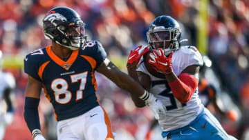 DENVER, CO - OCTOBER 13: Kevin Byard #31 of the Tennessee Titans intercepts a pass intended for Noah Fant #87 of the Denver Broncos in the third quarter at Empower Field at Mile High on October 13, 2019 in Denver, Colorado. (Photo by Dustin Bradford/Getty Images)