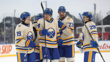 HAMILTON, ONTARIO - MARCH 13: Members of the Buffalo Sabres celebrate a goal against the Toronto Maple Leafs in the third period during the Heritage Classic at Tim Hortons Field on March 13, 2022 in Hamilton, Ontario. (Photo by Claus Andersen/Getty Images)