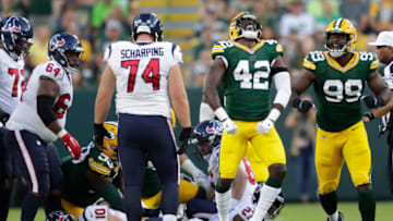 Aug 14, 2021; Green Bay, WI, USA; Green Bay Packers linebacker Oren Burks (42) celebrates sacking Houston Texans quarterback Davis Mills (10) during their football game Saturday, August 14, 2021, at Lambeau Field in Green Bay, Wis. Mandatory Credit: Dan Powers-USA TODAY Sports