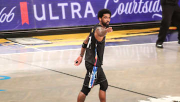 Brooklyn Nets guard Kyrie Irving (11) points to the crowd : Wendell Cruz-USA TODAY Sports