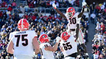 ATLANTA, GA - NOVEMBER 27: Daijun Edwards celebrates with teammates after scoring a touchdown against the Georgia Tech Yellow Jackets during the fourth quarter at Bobby Dodd Stadium on November 27, 2021 in Atlanta, Georgia. (Photo by Adam Hagy/Getty Images)