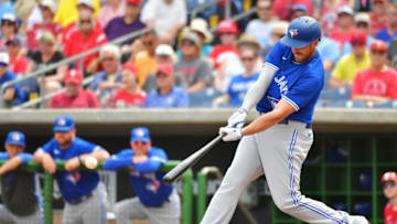 CLEARWATER, FLORIDA - MARCH 05: Travis Shaw #6 of the Toronto Blue Jays hits an RBI single off of Zack Wheeler #45 of the Philadelphia Phillies during the first inning of a Grapefruit League spring training game at Spectrum Field on March 05, 2020 in Clearwater, Florida. (Photo by Julio Aguilar/Getty Images)