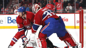 Dec 8, 2016; Montreal, Quebec, CAN; Montreal Canadiens goalie Carey Price (31) battles Devils right wing Kyle Palmieri (21) and defenseman Jeff Petry (26) during the first period at Bell Centre. Mandatory Credit: Jean-Yves Ahern-USA TODAY SportsODAY Sports