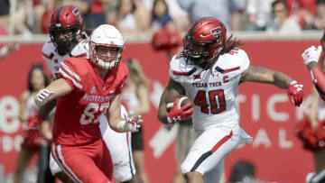 HOUSTON, TX - SEPTEMBER 23: Connor Killian #40 of the Texas Tech Red Raiders intercepts the ball and runs it back against Romello Brooker #82 of the Houston Cougars in the first quarter at TDECU Stadium on September 23, 2017 in Houston, Texas. (Photo by Thomas B. Shea/Getty Images)