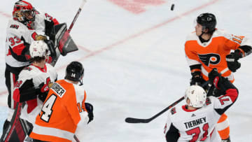 PHILADELPHIA, PA - NOVEMBER 27: Goaltender Mike McKenna #33 of the Ottawa Senators makes a blocker save as Chris Tierney #71 and Thomas Chabot #72 defend against Sean Couturier #14 and Travis Konecny #11 of the Philadelphia Flyers on November 27, 2018 at the Wells Fargo Center in Philadelphia, Pennsylvania. (Photo by Len Redkoles/NHLI via Getty Images)