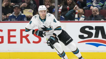 VANCOUVER, BC - JANUARY 18: Brenden Dillon #4 of the San Jose Sharks skates with the puck during NHL action against the Vancouver Canucks at Rogers Arena on January 18, 2020 in Vancouver, British Columbia, Canada. (Photo by Rich Lam/Getty Images)