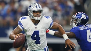 Sep 11, 2016; Arlington, TX, USA; Dallas Cowboys quarterback Dak Prescott (4) scrambles away from New York Giants cornerback D. Rodgers-Cromartie (41) at AT&T Stadium. Mandatory Credit: Erich Schlegel-USA TODAY Sports
