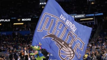 Apr 9, 2014; Orlando, FL, USA; Orlando Magic mascot, Stuff, holds a big flag against the Brooklyn Nets during the second half at Amway Center. Orlando Magic defeated the Brooklyn Nets 115-111. Mandatory Credit: Kim Klement-USA TODAY Sports
