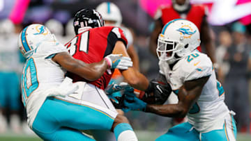 ATLANTA, GA - OCTOBER 15: Cordrea Tankersley #30 defends as Reshad Jones #20 of the Miami Dolphins intercepts this pass intended for Austin Hooper #81 of the Atlanta Falcons at Mercedes-Benz Stadium on October 15, 2017 in Atlanta, Georgia. (Photo by Kevin C. Cox/Getty Images)