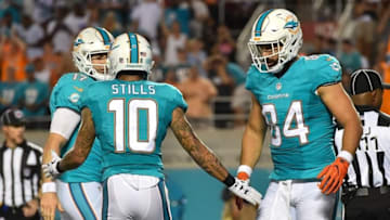 Aug 25, 2016; Orlando, FL, USA; Miami Dolphins running back Arian Foster (34) celebrates his touchdown against the Atlanta Falcons with wide receiver Kenny Stills (10) and quarterback Ryan Tannehill (17) during the first half at Camping World Stadium. Mandatory Credit: Jasen Vinlove-USA TODAY Sports