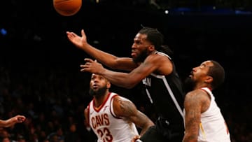 BROOKLYN, NY - MARCH 25: (NEW YORK DAILIES OUT) DeMarre Carroll #9 of the Brooklyn Nets in action against LeBron James #23 of the Cleveland Cavaliers at Barclays Center on March 25, 2018 in the Brooklyn borough of New York City. The Cavaliers defeated the Nets 121-114. NOTE TO USER: User expressly acknowledges and agrees that, by downloading and/or using this photograph, user is consenting to the terms and conditions of the Getty Images License Agreement. (Photo by Jim McIsaac/Getty Images)