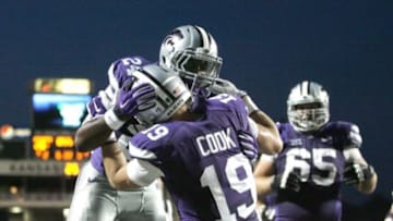 Aug 30, 2014; Manhattan, KS, USA; Kansas State Wildcats wide receiver Kody Cook (19) is congratulated by running back Charles Jones (24) following a touchdown by Cook during a 55-16 win against the Stephen F. Austin Lumberjacks at Bill Snyder Family Stadium. Mandatory Credit: Scott Sewell-USA TODAY Sports