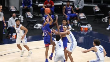 INDIANAPOLIS, INDIANA - DECEMBER 01: Dajuan Harris #3 of the Kansas Jayhawks shoots the ball while defended by Isaiah Jackson #23 of the Kentucky Wildcats in the State Farm Champions Classic at Bankers Life Fieldhouse on December 01, 2020 in Indianapolis, Indiana. (Photo by Andy Lyons/Getty Images)